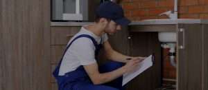plumber looking at a checklist