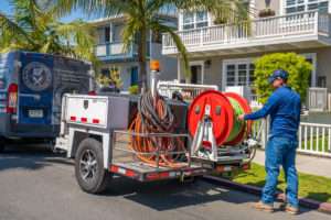 all service plumber truck with worker preparing for plumbing service