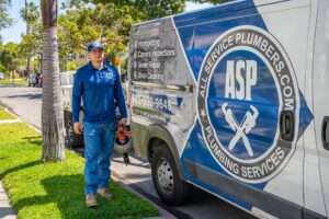 Employee Besides Van of All Service Plumbers